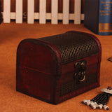 Wooden treasure chest with woven top on a wooden surface