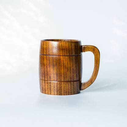 Wooden mug with handle on a white background
